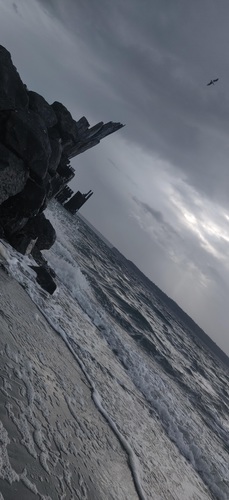 Surf around cragged rocks, Surf around cragged rocks on a dark morning